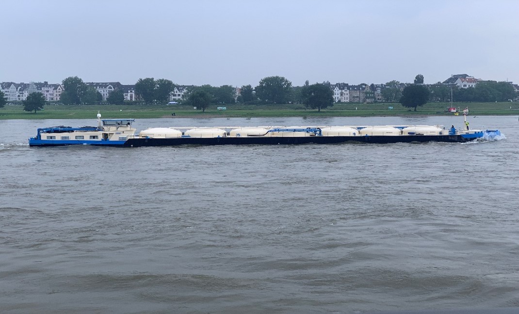 Modern inland waterway vessel on European river - representing future-proof IWT education